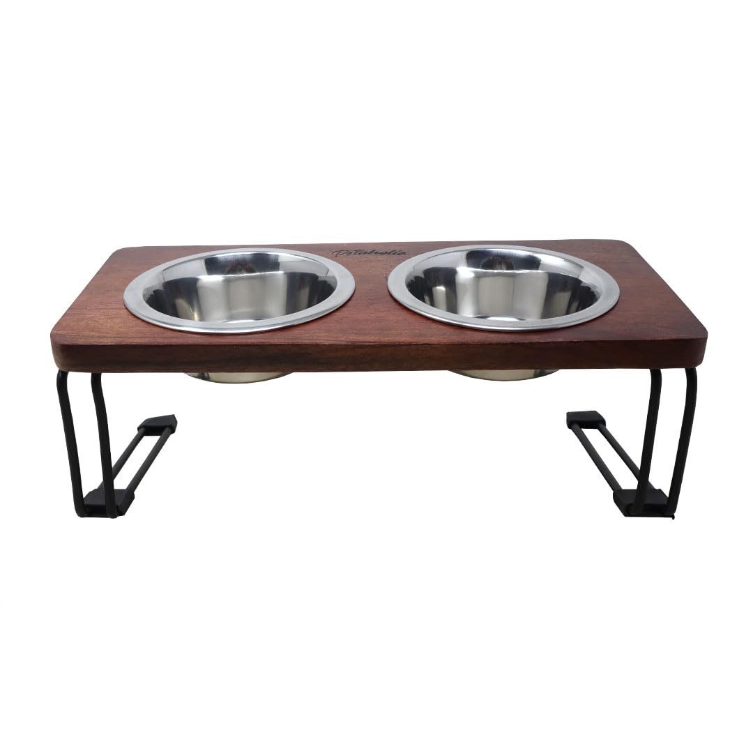 Wooden pet feeder with two metal bowls on a white background