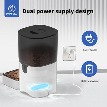Black and white pet feeder with dual power supply design on a light gray background