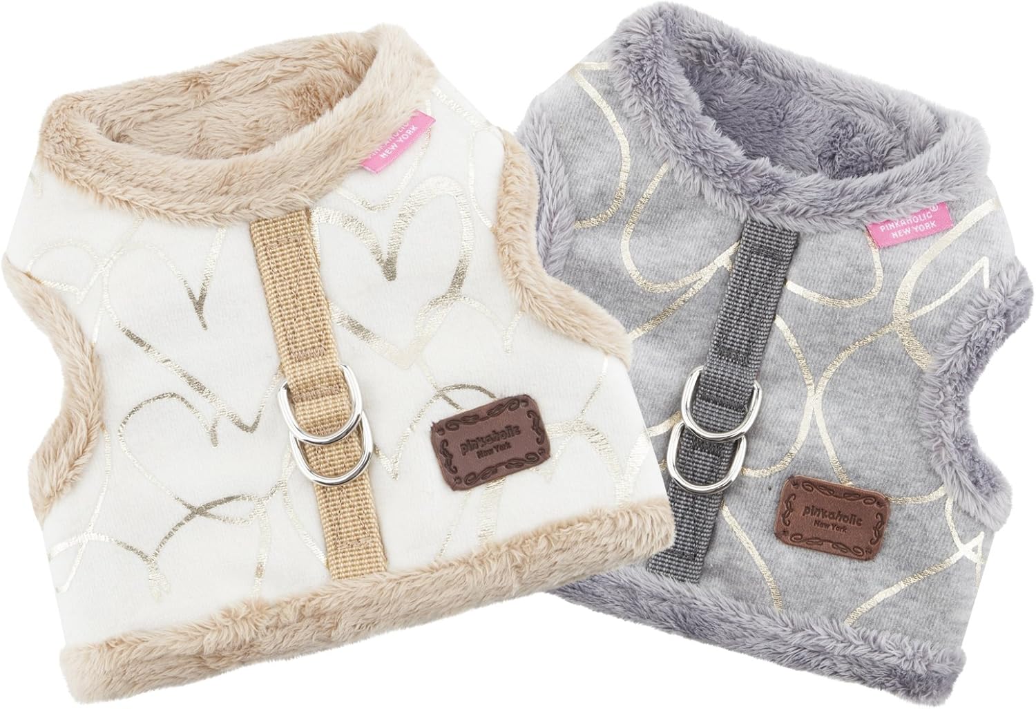 Two pet harnesses, one white and one gray, with textured patterns and brown leather tags.
