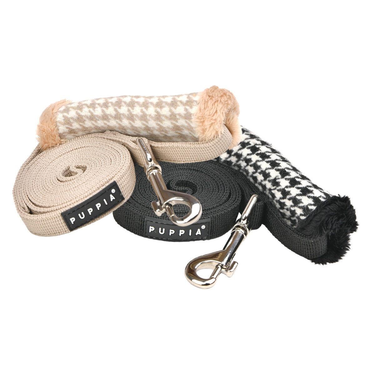 Dog leashes with houndstooth and checkered patterns, branded 'Puppia', on a white background