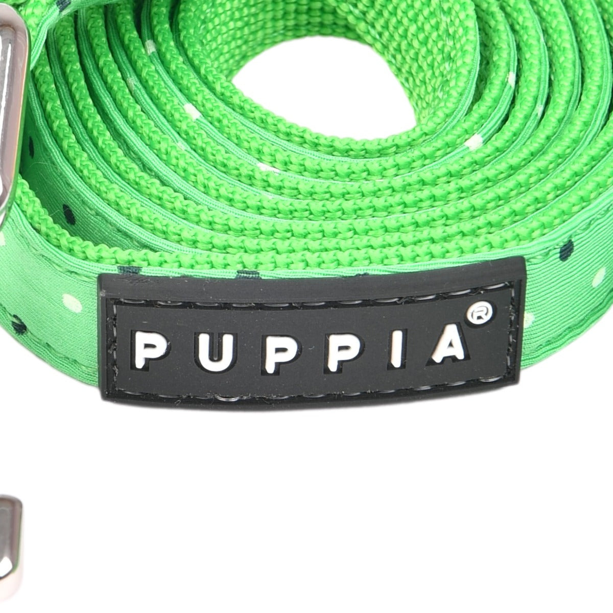 Green dog leash with Puppia label on a white background