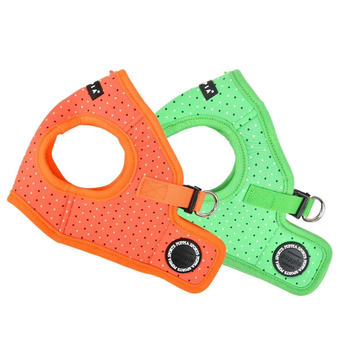 Two dog puppia harnesses, one orange and one green